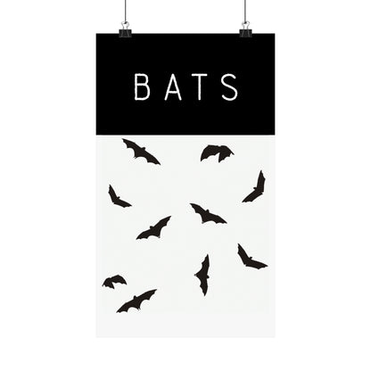 Poster of bats in white background with clips holding the poster up