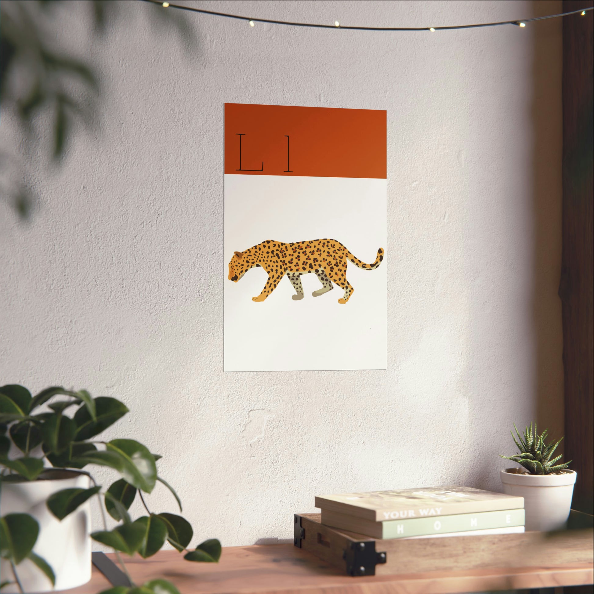 Leopard Poster on White Wall With a Plant and Books